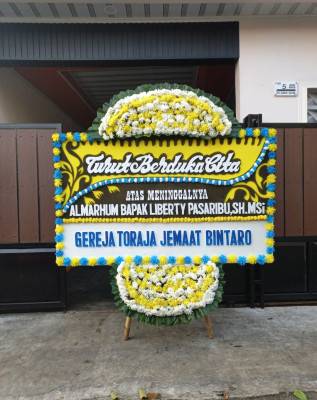Papan Bunga Duka di Warung Jaud